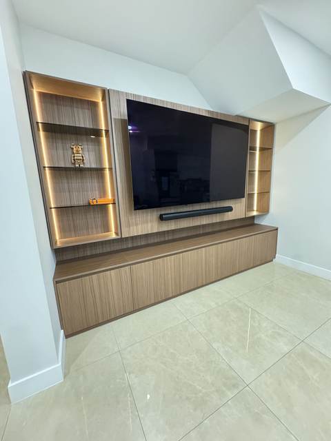 Oak veneer media unit with LED-lit open shelving and low base cabinets